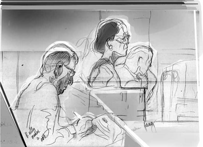 Mr. Reilly makes a note while Mrs. Fang looks on.